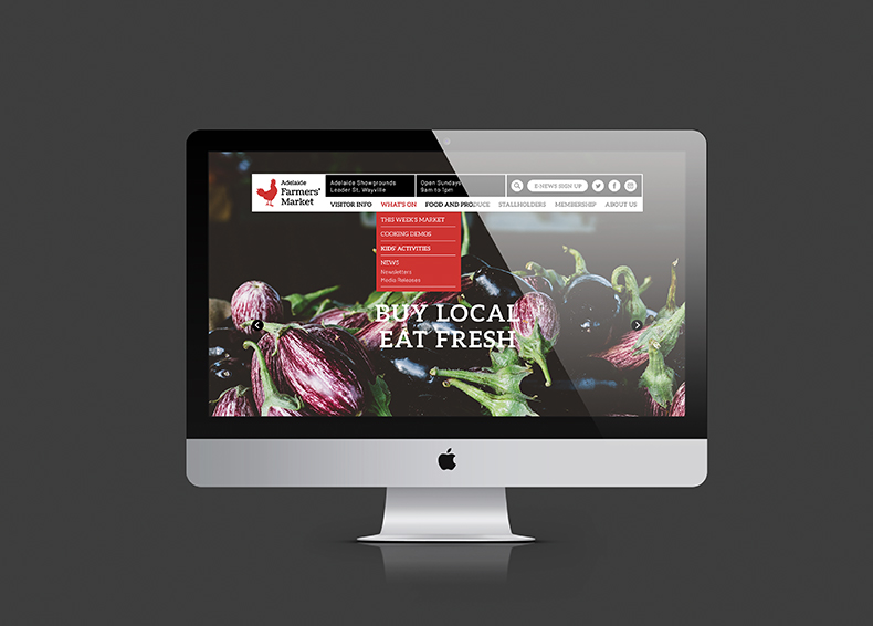 Adelaide Showground Farmers' Market website homepage designed by communikate et al shown inside an Apple Mac screen