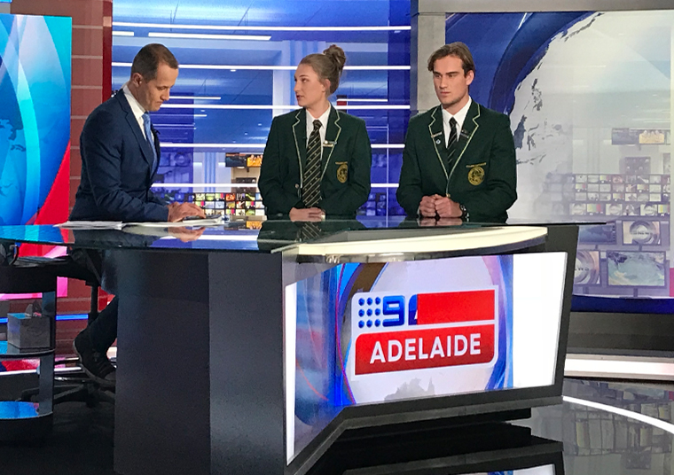 Mercedes College senior students sitting at the Channel 9 news desk